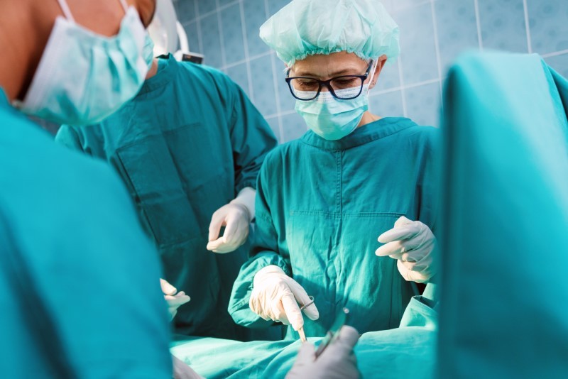 Surgery team operating in a surgical room